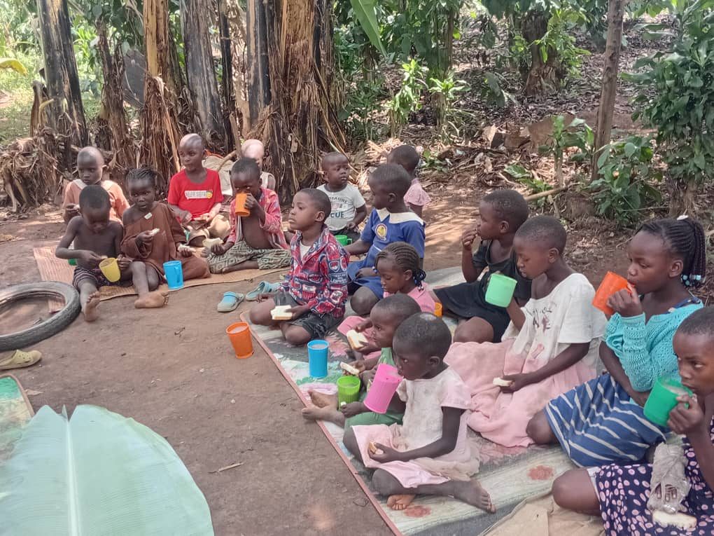 Children sharing a meal at a SafeHaven feeding